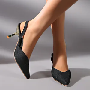 Close-up of elegant black glittery pointed-toe slingback high heels