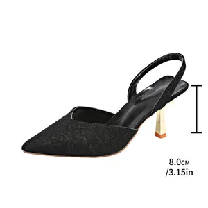 Detailed side view of black glitter pointed toe slingback sandals with 8cm gold heel