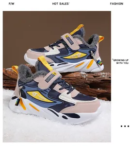 Side view of boys' winter sports shoes with fleece lining on snowy background