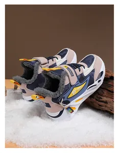 Close-up of boys winter sneakers featuring warm plush lining and camo leather design