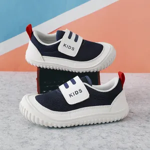 Breathable navy blue children's mesh sneakers with white soles and red accents