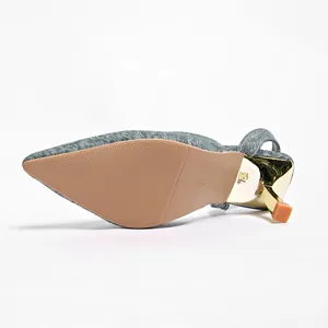 Detailed view of the non-slip sole and golden stiletto heel on slingback pumps