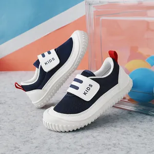 Breathable navy mesh children's sports shoes with white velcro straps and red tabs