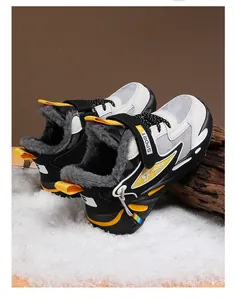 Close-up of children's winter sneakers with warm faux fur lining and velcro straps.