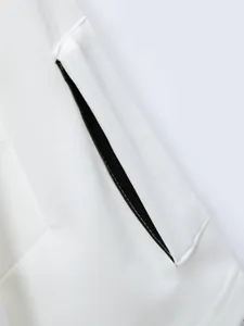 Close-up macro view showing the tactical arm pocket detail on a white men's short-sleeved Polo shirt