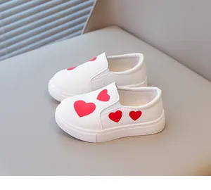 Stylish white toddler girls' slip-on shoes with red heart patterns and soft soles