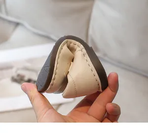 Soft and flexible children's leather shoe showing durable folding sole