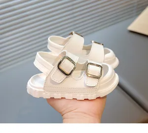 Close-up of white breathable children's sandals with stylish double buckle design