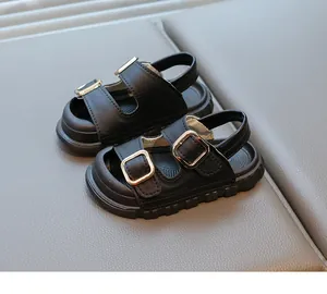 Black kids' sandals with gold buckles and thick non-slip soles for summer comfort.