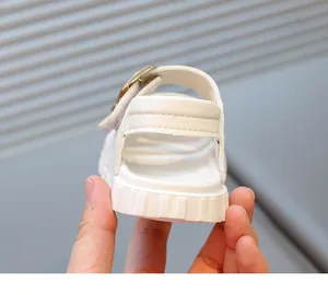 Detailed rear view of white toddler sandal showing heel strap and anti-slip sole