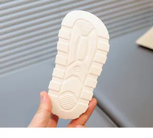 Close-up of the textured anti-slip white sole for breathable children's summer sandals