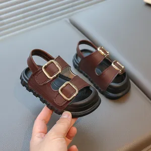 Stylish brown summer sandals for kids featuring gold metal buckles and durable thick soles