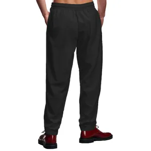 Vista trasera de joggers negros holgados de hombre con cintura y puños elásticos