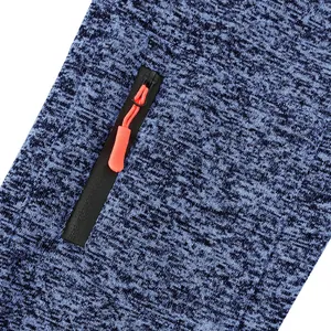 Detail view of a cationic fabric hoodie featuring a black zipper pocket with orange pull.