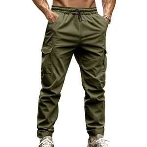Close-up detail of olive green tactical cargo pants featuring durable pockets and drawstring.