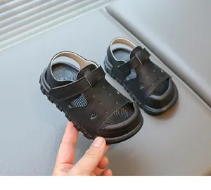 Close-up of black toddler sandals featuring protective closed-toe and soft non-slip sole