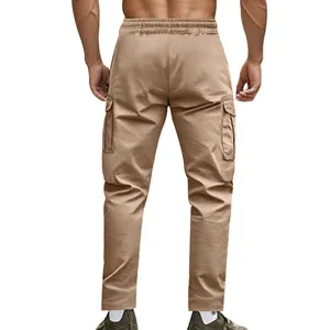 Back view detail of men's khaki tactical cargo pants with elastic waist and side pockets