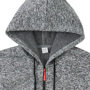 Close-up view of the fabric texture and red zipper detail on gray heathered hoodie