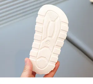 Detailed macro view showing the anti-slip soft sole of toddler beach sandals, size 23.