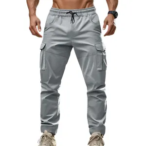 Detailed view of American style outdoor men's tactical cargo pants in light gray color