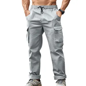 Detail view of men's grey tactical cargo pants with elastic waist and side pockets.