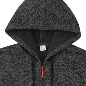 Detail shot showing the size label and contrast zipper pull of the men's fleece hoodie