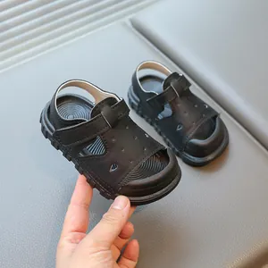 Classic black children's sandals with soft sole and semi-closed toe design for toddlers