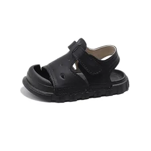 Black toddler sandals with soft sole and closed-toe design for boys and girls