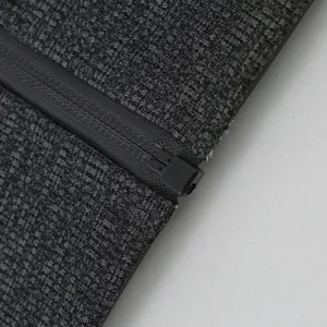 Close-up macro detail of the premium zipper and cation fleece fabric on men's hoodie