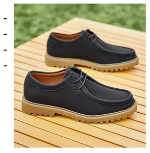 Close-up of men's vintage dark grey leather Wallabee style casual shoes in outdoor