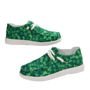 Green canvas sneakers with shamrock clover print and white soles for women