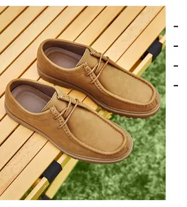 Classic men's tan leather wallabee shoes in an outdoor lifestyle setting