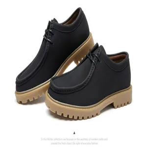 Classic men's black suede Wallabee shoes with chunky tan lug sole for vintage style
