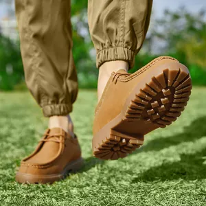 Vintage brown men's Wallabee workwear shoes with thick lugged soles for outdoor use