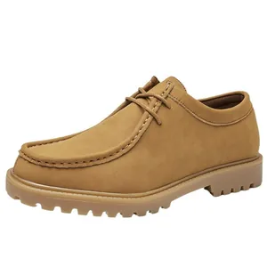 Men's classic tan suede wallabee shoes with lace-up closure and thick lug sole for outdoor.
