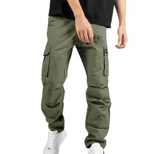 Macro view of olive green cargo pants featuring multi-pocket design and cuffed hems