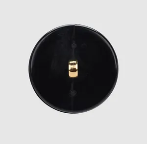 Close-up of the gold metal shank on a high-end black plant fiber nylon button.
