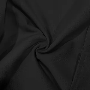 Macro view showing the detailed texture of black ribbed fabric for mens cargo pants