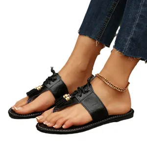 Stilvolle schwarze flache Quastensandalen mit Schnürung und Zehensteg für Damen