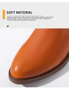 Detailweergave van zachte bruine Martin-laarzen met puntige neus en hoogwaardige materiaaltextuur