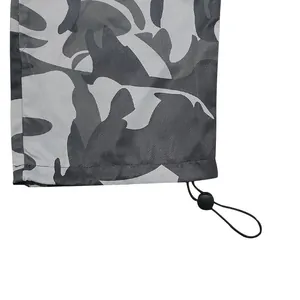 Macro detail of adjustable drawstring and toggle on grey camouflage cargo pants leg cuff
