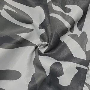 Close-up macro view showing the texture and gray camouflage pattern of men's cargo pants.