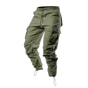 Full detail of olive green men's cargo pants featuring multi-pockets and drawstring hem.
