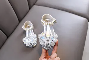 Sparkling silver girls princess shoes with large butterfly and pearls for dance parties.