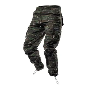 Close-up of men's tiger stripe camo cargo pants with multi-pockets and drawstring cuffs.