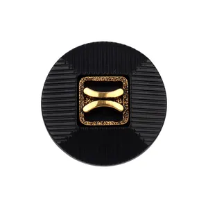 Elegant high-end black nylon button with a textured golden center decorative motif