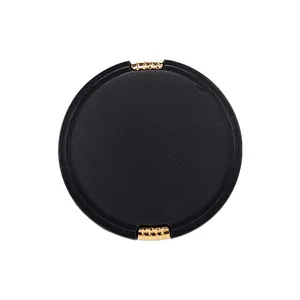 Elegant black plant fiber nylon button with gold metal accents for high-end garments