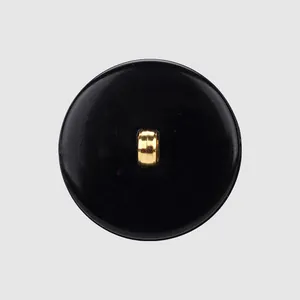 Elegant black plant fiber nylon button with a polished gold metal shank back detail