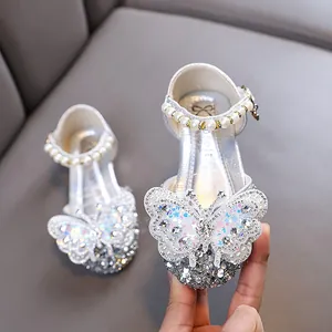 Silver glittery girls princess shoes featuring butterfly sequins and pearl straps