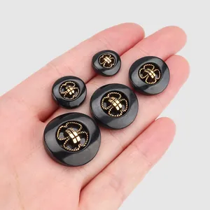 High-end black plant fiber nylon buttons with gold decorative knot centers in various sizes